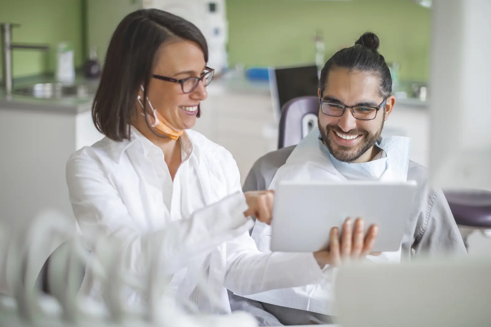 Dentist reviewing treatment information with a patient