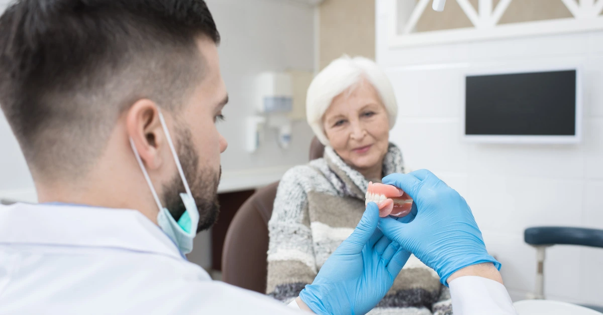 Dentist discussing dentures with a patient