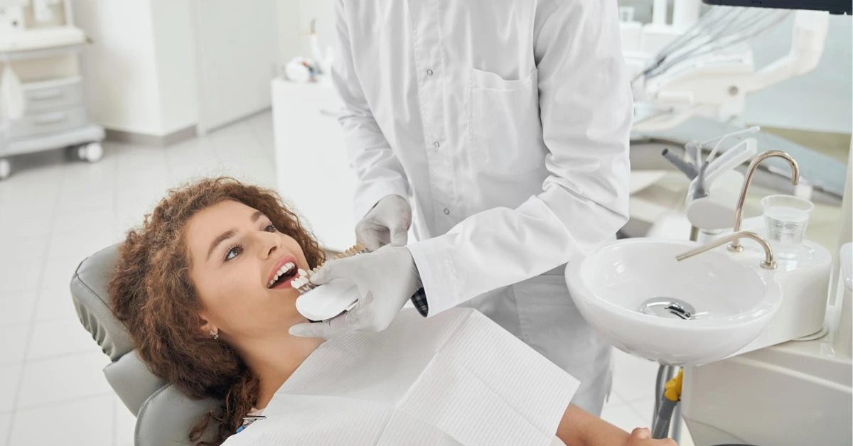 Dentist explaining dental implant treatment options to a patient