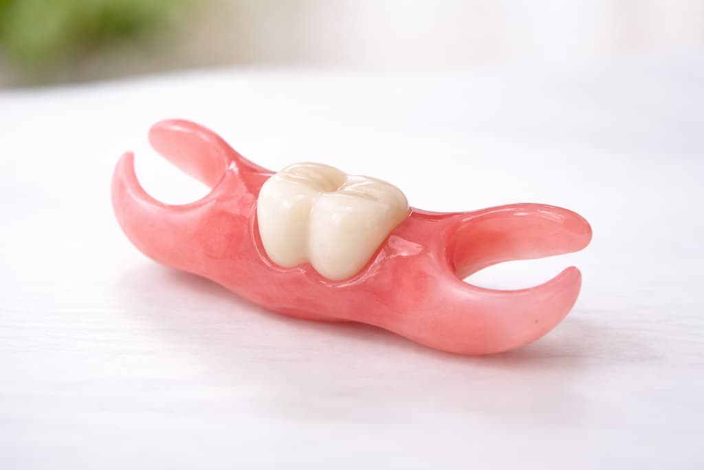 A temporary tooth flipper for a dental implant