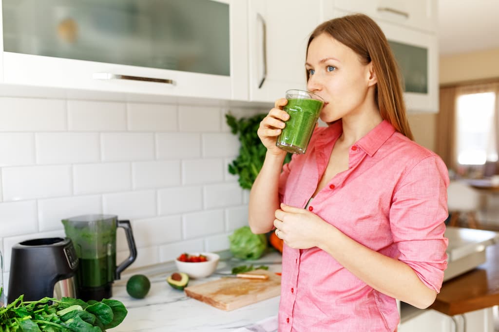 Drinking protein shakes after implant surgery.